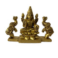 Svarn Studio Pure Brass Gaj Lakshmi Idol - Lifestyle shot on marble console with circular mirror backdrop