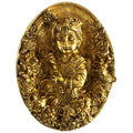 Svarn Studio Brass Bal Krishna Oval Wall Decor Plate - Lifestyle shot on rustic wooden surface with jasmine flowers