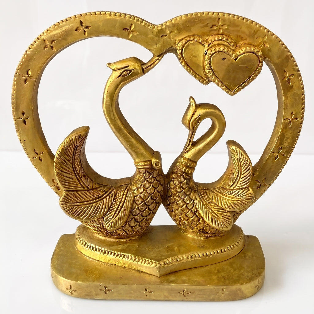 Svarn Studio Brass Kissing Swan Love Birds - Lifestyle shot on rustic wooden console with books and ceramic bowl