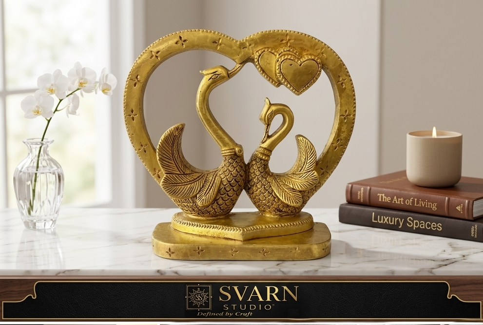 Svarn Studio Brass Kissing Swan Love Birds - Multi-panel collage: marble console lifestyle, close-up feather detail, heart crown close-up, executive desk setting, Svarn Studio branding