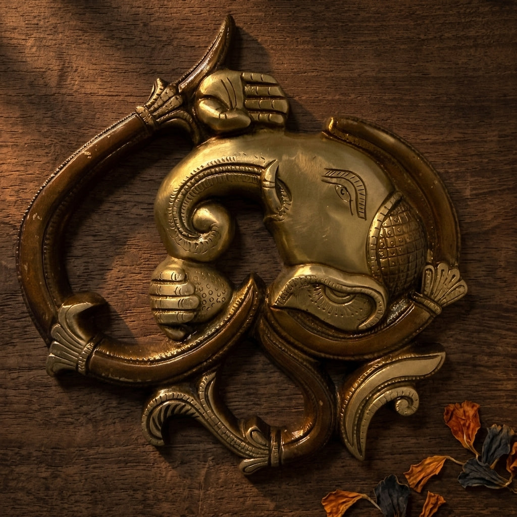 Svarn Studio Brass Ganesha Om Wall Hanging - Warm Lifestyle on Wooden Surface