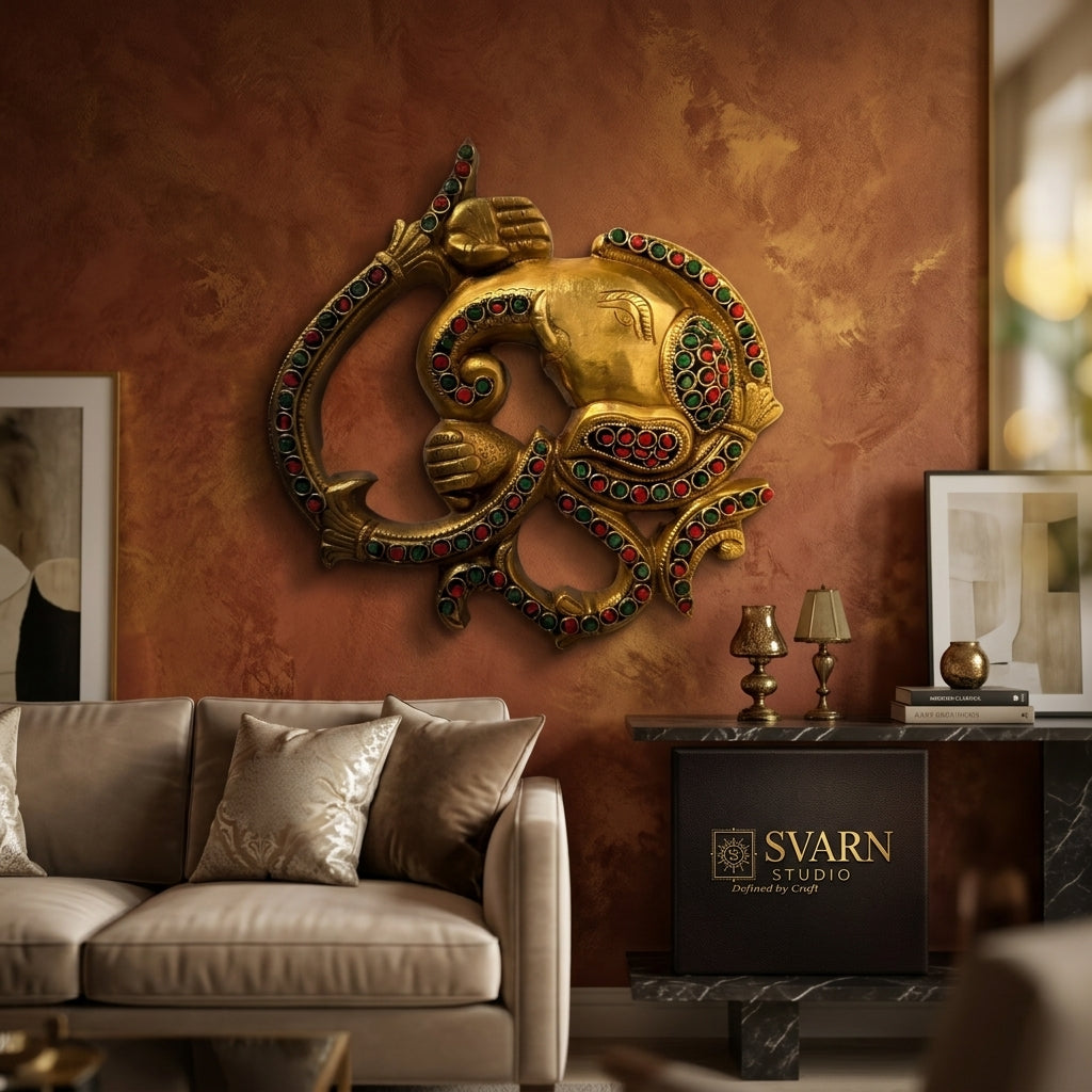 Svarn Studio Brass Ganesha Om Wall Hanging with Stone Work - Living Room Lifestyle Cream Wall with Orchids