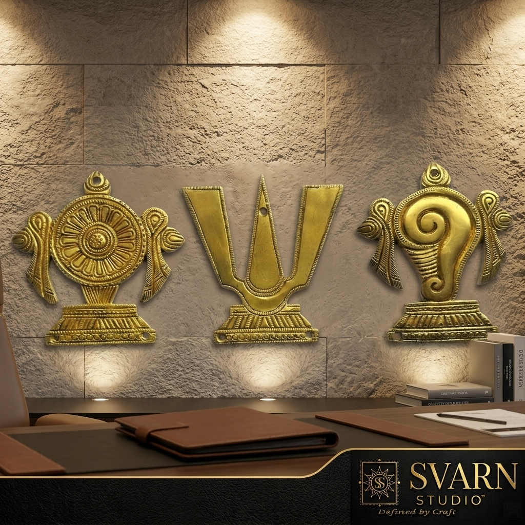 Svarn Studio Brass Padam Shankh Chakra Wall Decor - Lifestyle shot on stone textured wall with office desk setting